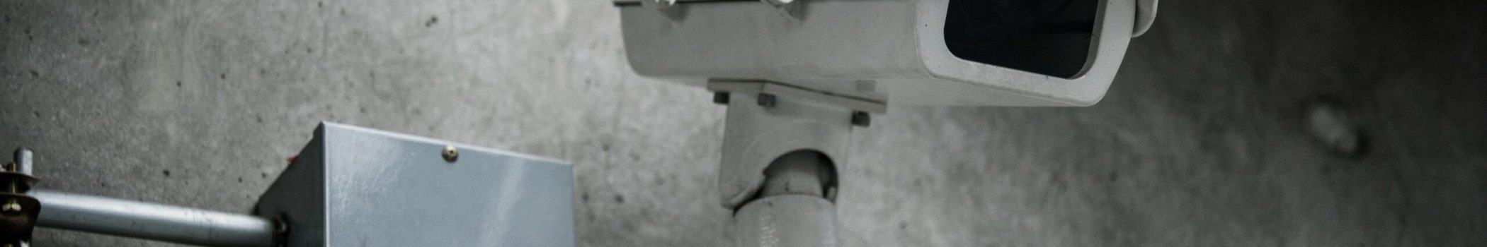 closeup-cctv-camera-wall_compressed